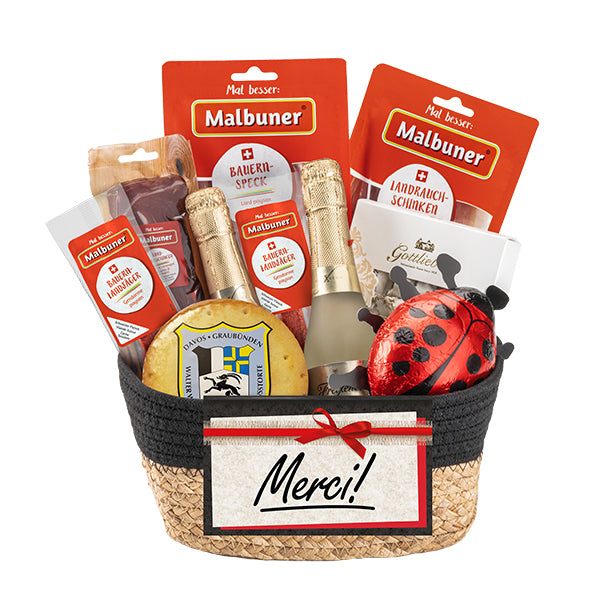 Danke Korb, Geschenkkorb mit zahlreichen schmackhaften Produkten von Malbuner und weiteren Köstlichkeiten in einem Korb mit Stoffrand